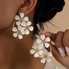 Elegant white floral statement earrings with gold accents, perfect for special occasions and fashion-forward looks. Explore Monalisa Store's collection of stylish jewelry today.