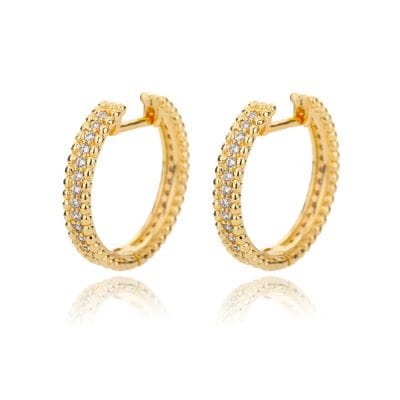 Elegant gold hoop earrings with sparkling cubic zirconia stones, perfect for stylish jewelry collection, showcasing luxury and craftsmanship.