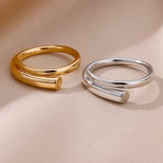 Gold and silver open cuff rings on beige fabric, stylish gemstone jewelry for women, Monalisa Store luxury fashion accessories.