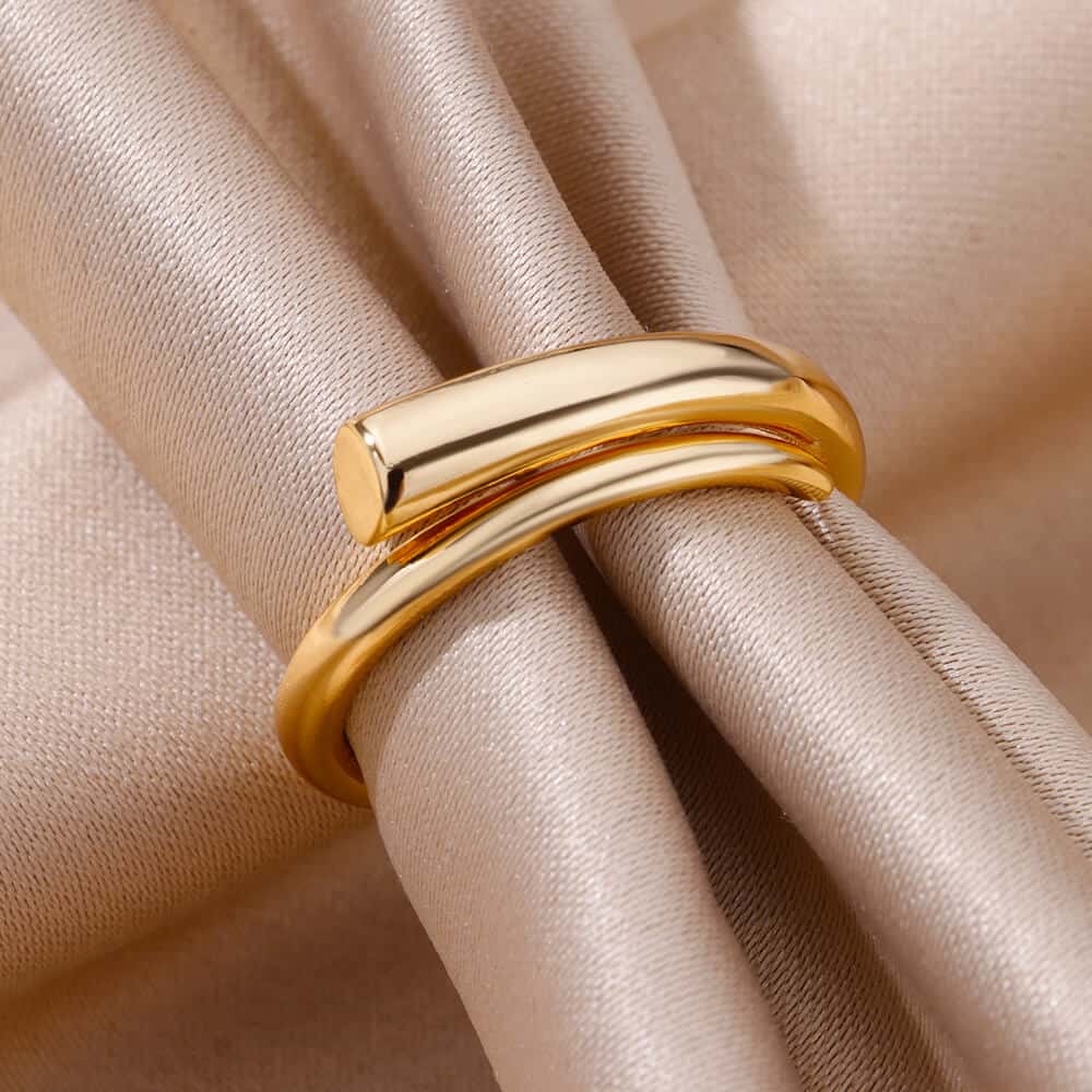 Shiny gold ring on beige fabric, luxurious jewelry accessory, elegant fashion statement, stylish gift, Monalisa Store jewelry collection.