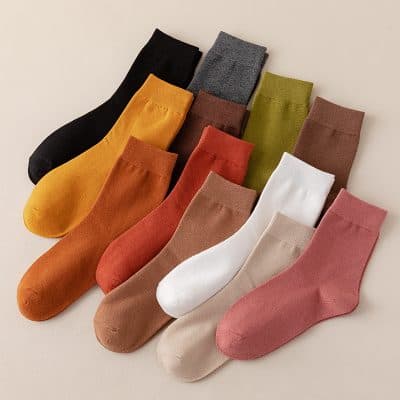 Colorful variety of high-quality socks in different shades including mustard, black, gray, olive, brown, white, beige, and pink, ideal for fashion and comfort at Monalisa Store.