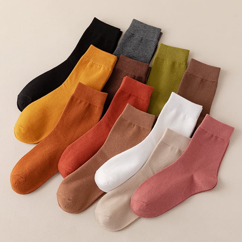 Colorful variety of high-quality socks in different shades including mustard, black, gray, olive, brown, white, beige, and pink, ideal for fashion and comfort at Monalisa Store.