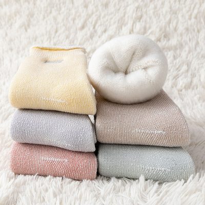 Luxury socks display at Monalisa Store, premium, comfortable, stylish, soft, high-quality fabrics, cozy winter wear, men's and women's fashion accessories, fashion retail, comfortable everyday style.