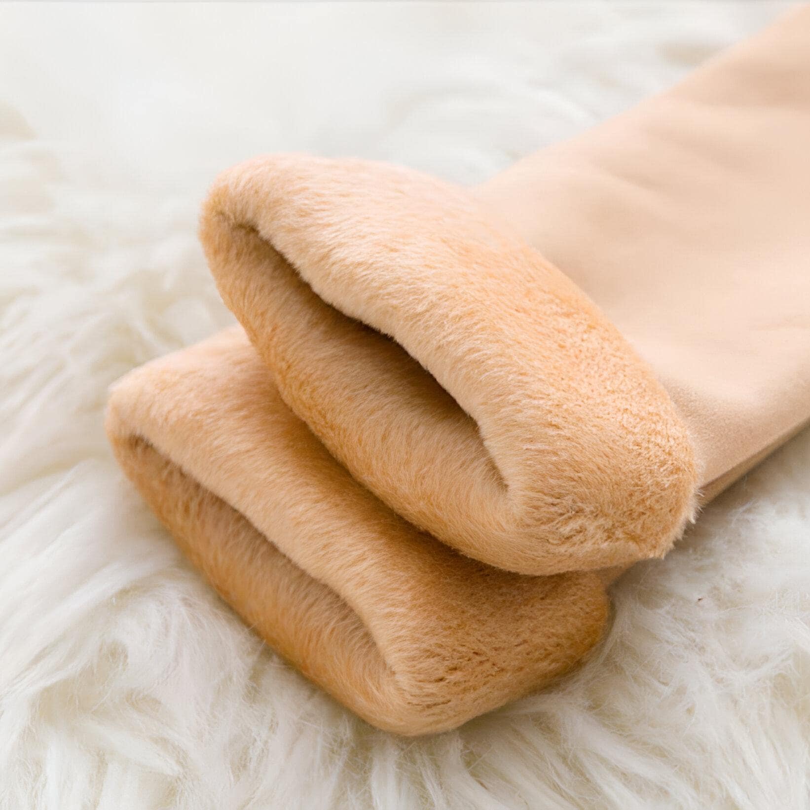 Luxurious beige fur-lined slippers for women, perfect for indoor comfort and style. Soft, cozy slippers designed to keep your feet warm and comfortable at home. Ideal for relaxation and everyday wear.