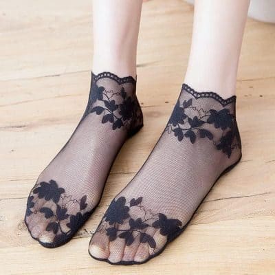 Elegant black lace footie socks with floral embroidery, perfect for stylish and comfortable wear; available at Monalisa Store.