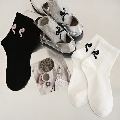 Black and white socks with bow design for women and men, stylish shoe accessories, and cozy socks at Monalisa Store. Perfect for comfortable, fashionable footwear and foot care.