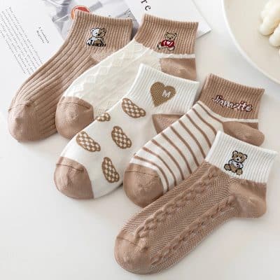Cute baby socks with teddy bear, heart, and stripe patterns, perfect for infants and toddlers from Monalisa Store. Soft, adorable, and comfortable for your little one's delicate feet.