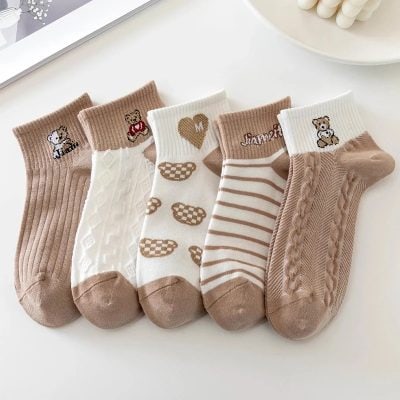 Cute baby socks with animal and heart patterns, perfect for infants and toddlers.