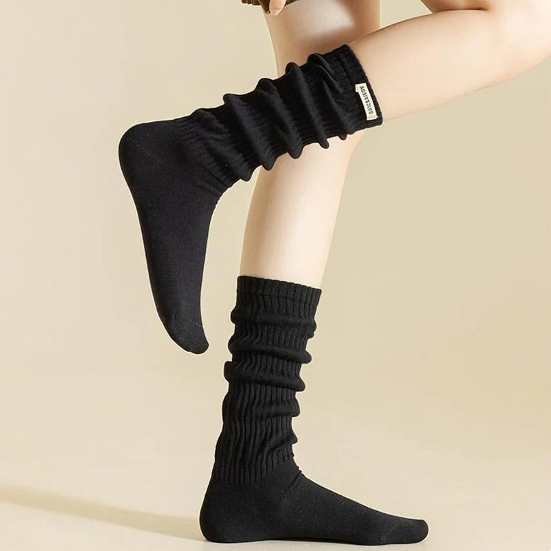 Comfy black knee-high socks for women, casual athletic footwear, Monalisa Store, versatile sock fashion, comfortable legwear for everyday use.
