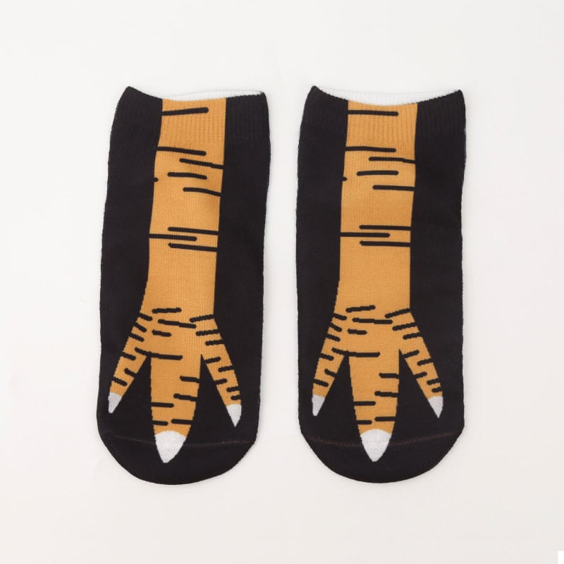 Comfortable novelty tiger-striped socks with black and orange design, perfect for casual or fun occasions. Ideal for animal print enthusiasts and sock collectors.