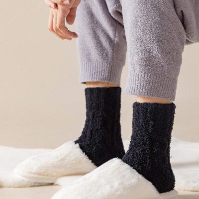 Comfy fluffy slippers with cozy black socks, perfect for relaxing at home and enhancing your comfort and style. Ideal for winter comfort and indoor lounging.