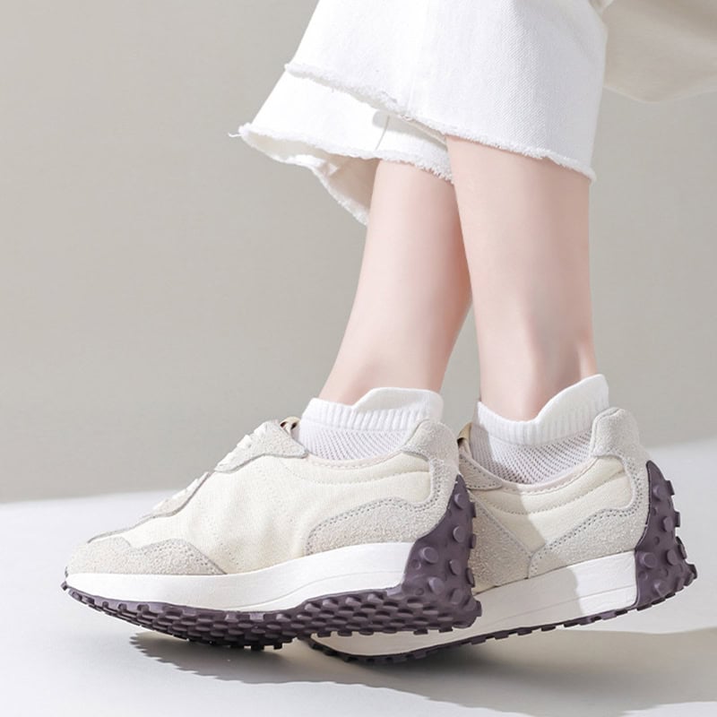 Comfy trendy white sneakers with textured sole, perfect for stylish casual footwear.