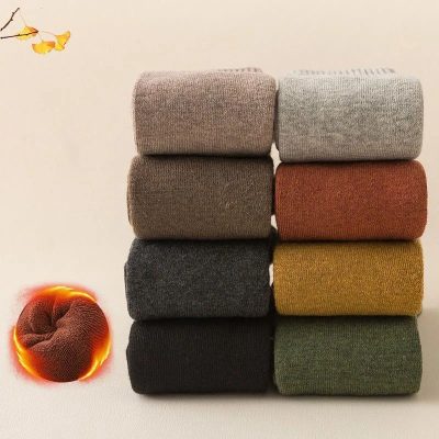 Black, grey, brown, mustard, rust, and beige socks neatly stacked, showcasing variety and comfort for everyday wear at Monalisa Store. Perfect for enhancing your fashion and footwear collection.