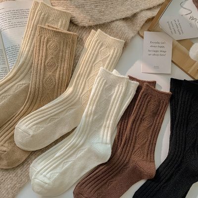 Soft knitted cozy socks in beige, cream, brown, and black for comfortable wear, suitable for all seasons and styles. Perfect for casual or elegant outfits, made from high-quality materials for ultimate comfort.