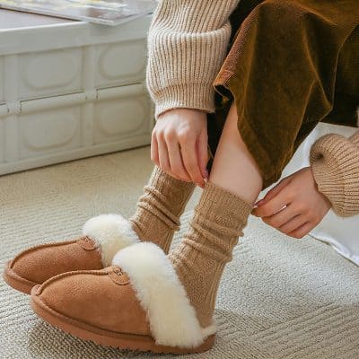 Warm cozy slippers with fluffy lining, ideal for indoor comfort on cold days.