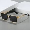 Sleek stylish black and gold sunglasses with modern design for men and women, perfect for fashion and UV protection at Monalisa Store.