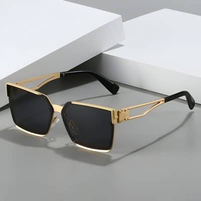 Sleek stylish black and gold sunglasses with modern design for men and women, perfect for fashion and UV protection at Monalisa Store.