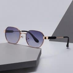 Luxury designer sunglasses with rose gold frame and dark tinted lenses for women and men.