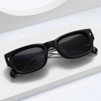 Bold black sunglasses with dark lenses, stylish and perfect for eye protection and fashion. Ideal for outdoor activities and complementing any outfit at Monalisa Store.