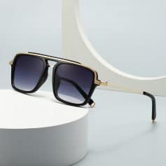 Black and gold designer sunglasses with gradient lenses, stylish eyewear for women and men, Monalisa Store optometry and eyewear retailer, high-fashion optical accessories, premium sunglasses collection.