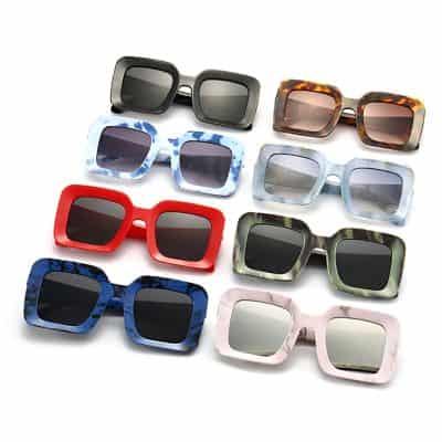 Bold and colorful oversized sunglasses with various frame styles, perfect for fashionable eye protection and style statements.