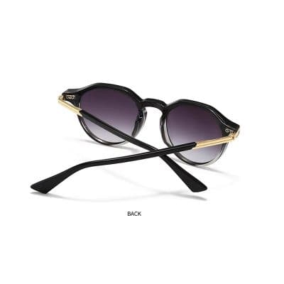 Stylish black and gold woman's sunglasses with gradient tinted lenses, perfect for sun protection and fashion.