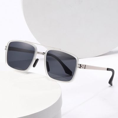 A pair of stylish white sunglasses with dark lenses, perfect for sun protection and fashion accessories.