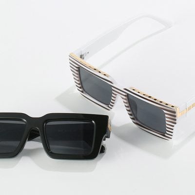 Luxury designer sunglasses with striped and solid black frames, stylish eyewear for fashion and sun protection, displayed on a clean white background at Monalisa Store.