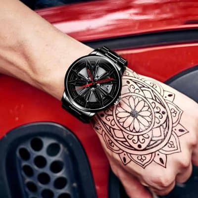 Black luxury wristwatch with a bold, modern design, worn on a tattooed wrist, showcasing stylish accessory options available at Monalisa Store for fashion-forward individuals interested in watches.