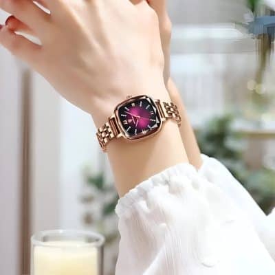 Famous luxury wristwatch on a woman's wrist with a rose gold band and purple watch face, emphasizing elegant accessories and stylish timepieces at Monalisa Store.