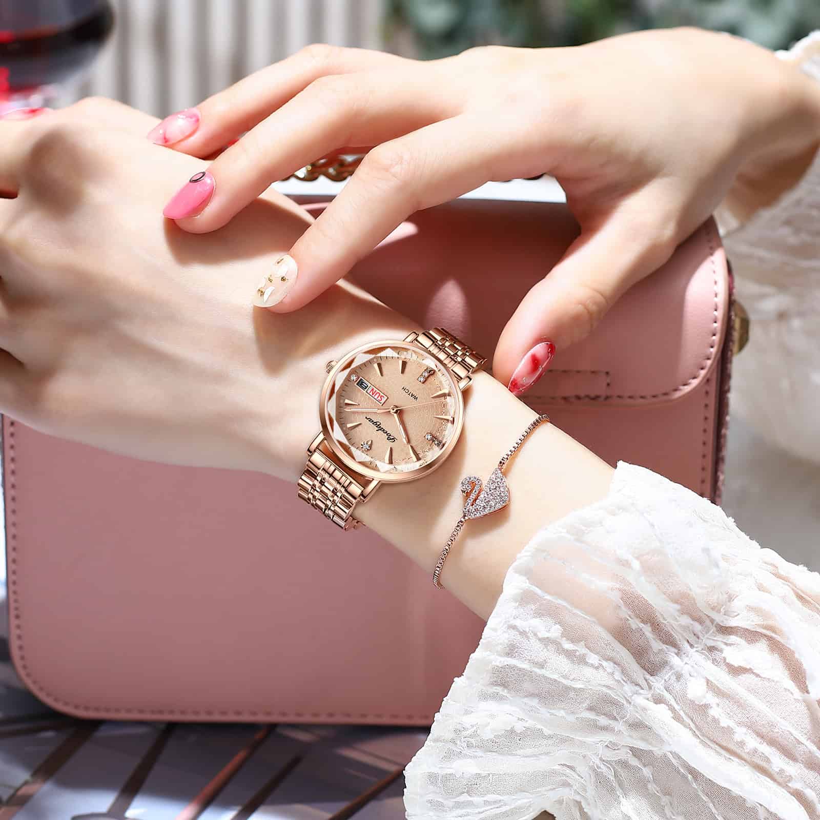 Elegant rose gold wristwatch with a matching bracelet, stylish manicured nails, and a pink handbag, showcasing Monalisa Medical's jewelry and accessory collection for women.