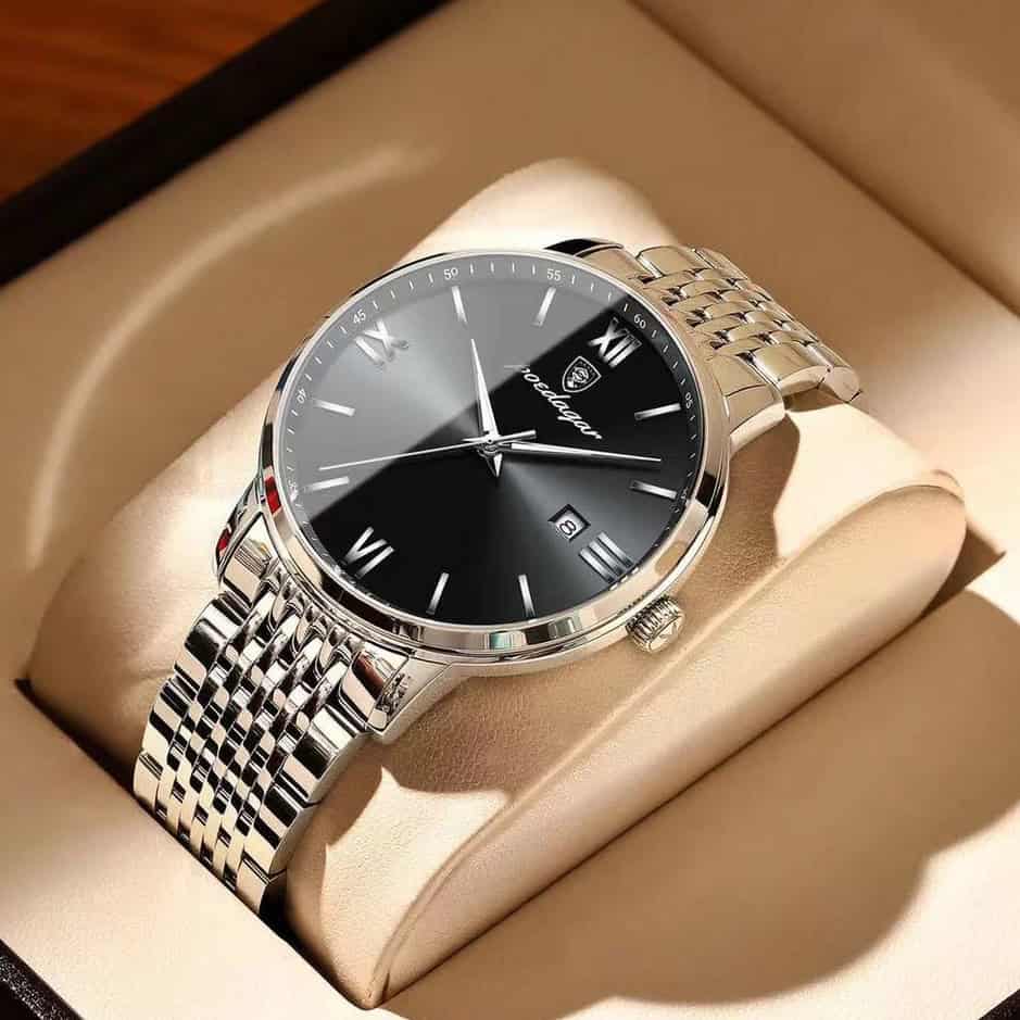 Stainless steel men's luxury wristwatch with black dial, Roman numerals, and date display, showcased in Monalisa Medical's store.