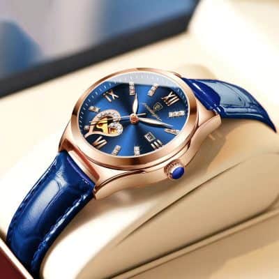 Rolex-style luxury wristwatch with blue dial and gold-tone case, featuring crystal hour markers, date display, and blue leather strap, ideal for stylish accessories and high-end fashion.
