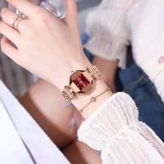 Luxury women's wristwatch with pink gold band and red dial, elegant jewelry accessories, stylish fashion watch for women.