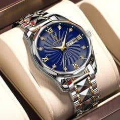Luxury men's wristwatch with a blue dial, gold accents, and stainless steel band, showcasing elegant design and craftsmanship.