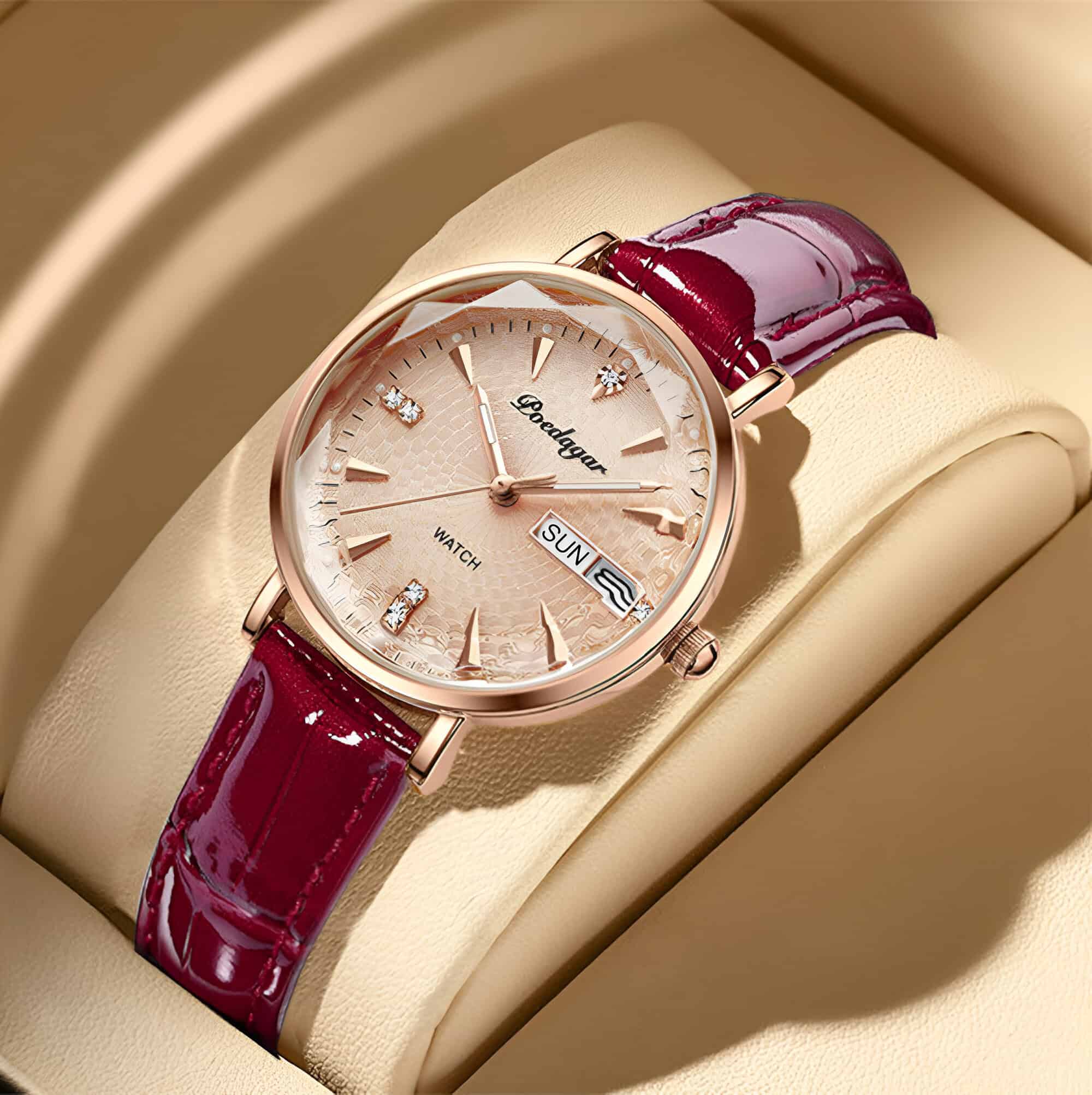 Elegant women's luxury wristwatch with a rose gold case, textured champagne dial, crystal hour markers, and a stylish burgundy leather strap, perfect for fashion-forward accessories.