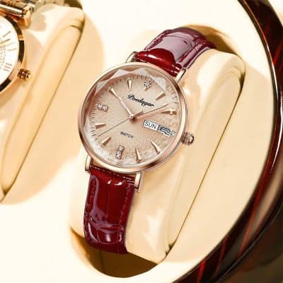 Elegant women's wristwatch with a rose gold case, diamond accents, and a deep red leather strap, perfect for luxury watch enthusiasts and stylish accessories.