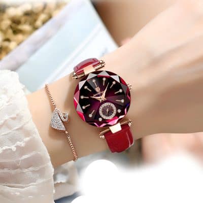 Luxurious red leather strap women's fashion watch with a black and red gemstone-inspired dial and sparkling crystal accents, perfect for elegant style and daily wear.