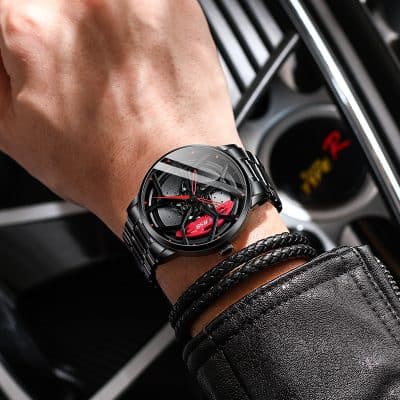 Luxury black wristwatch with red accents on man's wrist, close-up shot in car interior for Monalisa Store opt, luxury accessories for men and women, stylish timepiece, high-end watch collection.