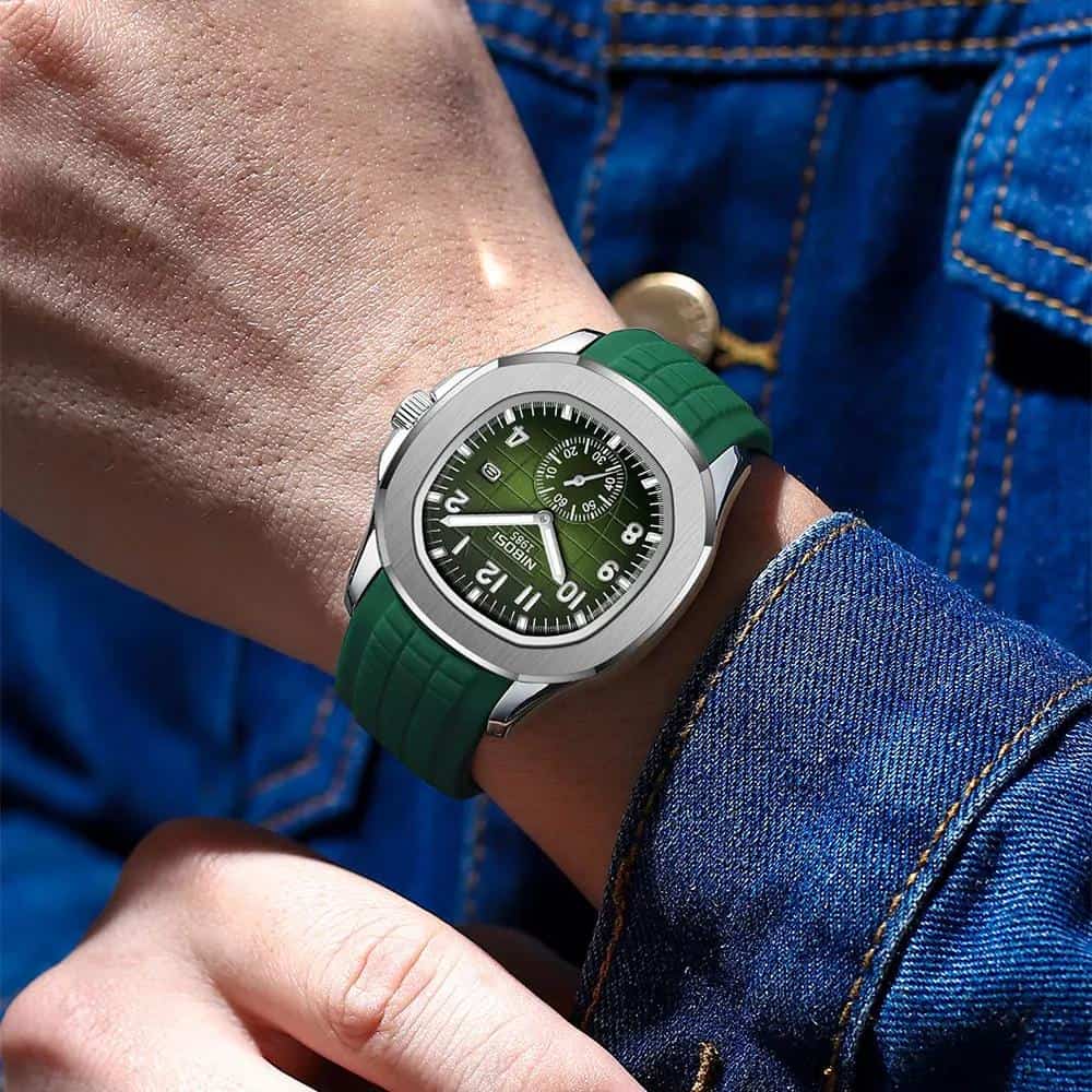 Stainless steel and green rubber strap wristwatch with chronograph features on a person's wrist wearing a denim jacket, showcasing luxury timepieces from Monalisa Store.