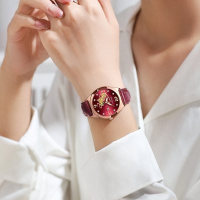 Luxurious red and gold wristwatch featuring floral design, ideal for elegant women who appreciate high-quality accessories and stylish timepieces.