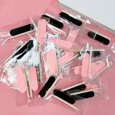 Disposable nail polish remover stick swabs with black and pink foam tips for beauty and nail care. Perfect for precise nail polish removal in salons or at home. Small, portable, and easy to use.