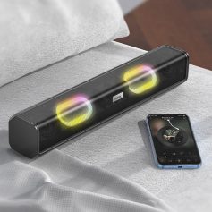 Hoco Bluetooth soundbar speaker with LED lights on sofa, smartphone showing music player, portable wireless audio device, modern tech for entertainment, premium sound quality for home and office use.