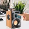 Portable wireless speaker with touch control, LED display, and wooden side panel for enhanced sound quality and stylish design for home or office use.