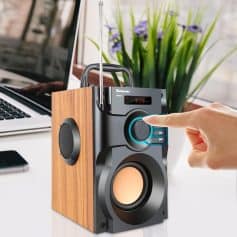 Portable wireless speaker with touch control, LED display, and wooden side panel for enhanced sound quality and stylish design for home or office use.