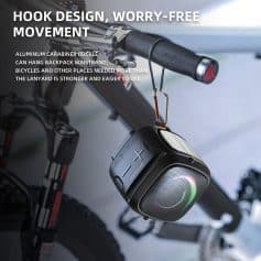 Wireless Bluetooth speaker hanging from bicycle handlebar with hook design, portable outdoor music device.