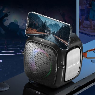 Wireless Bluetooth speaker with phone holder, portable music device, and colorful LED lights for karaoke, outdoor events, and parties.