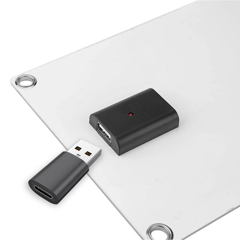 Small USB to HDMI converter, portable electronic accessory for connecting devices to external displays for enhanced visual experience.