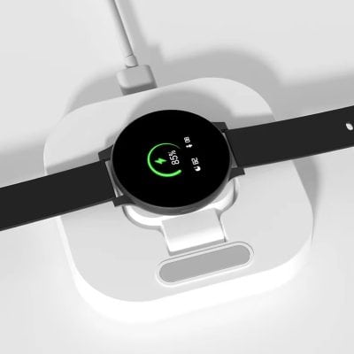 Wireless charging smartwatch with health tracking and digital display on a charging pad.