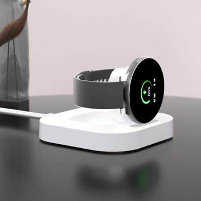 Realistic fitness tracker smartwatch charging on white dock, close-up of modern wearable device with digital display, health and wellness technology, Monalisa Medical Store, opt for advanced health monitoring gadgets.
